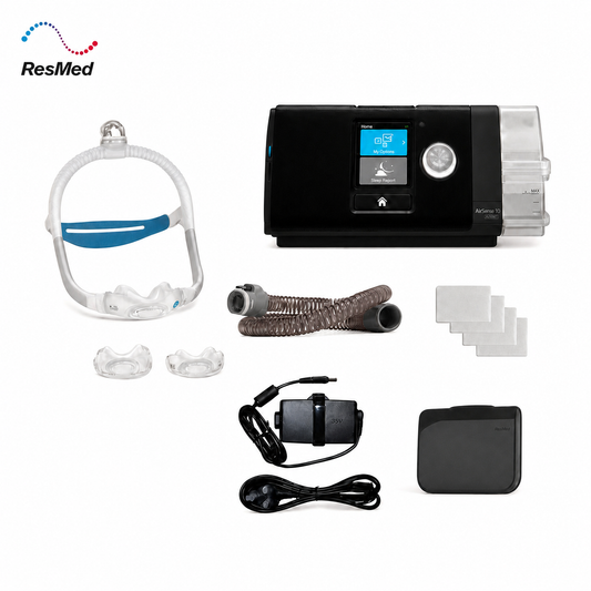 ResMed sleep apnea and CPAP treatment kit on a white background, including a black CPAP machine, mask, tubing, accessories, and a power adapter.
