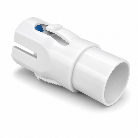 A white plastic medical connector or adapter with a small blue accent visible on the top surface, shown on a clean white background.