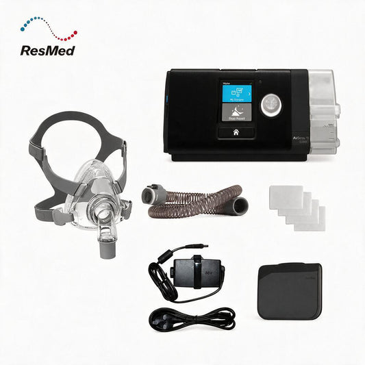 ResMed sleep apnea treatment kit on a white background, including a black CPAP machine, clear mask, breathing tube, power cord, battery, and accessories. ResMed logo is visible in the top left.