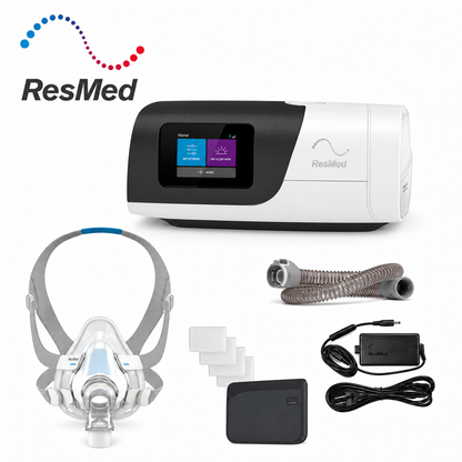 ResMed CPAP machine kit on a white background, including the main CPAP unit with a color display screen, a sleep mask with gray headband, a breathing tube, power adapter, cables, and accessory pads. ResMed logo is visible in the top left.