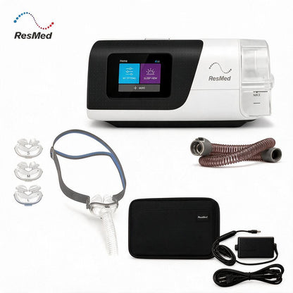 ResMed CPAP machine with accessories including three mask sizes, headgear, tubing, carrying case, and power adapter on a white background.